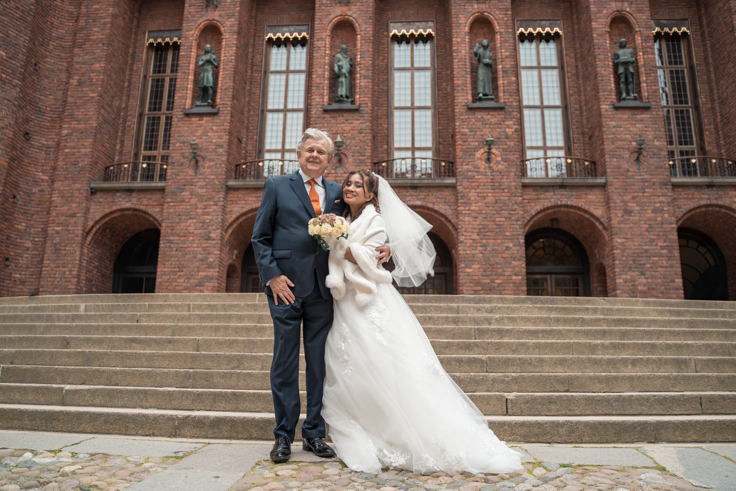 Newlyweds on the steps of Stockholm City Hall